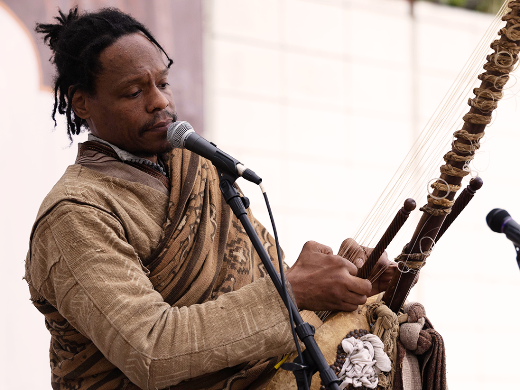 Man playing traditional instrument