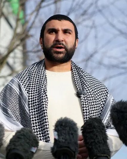 Journalist Sami Hamdi speaking to reporters